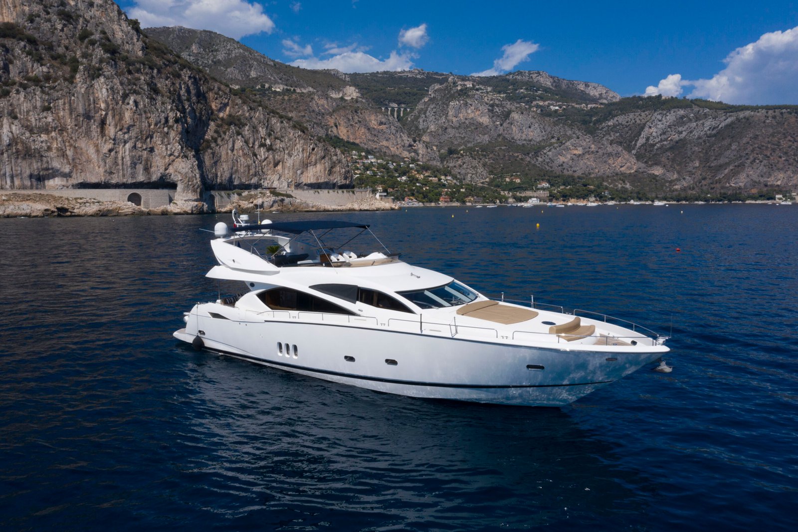 Sunseeker 82 running past the coast near Port Hercules, Monaco